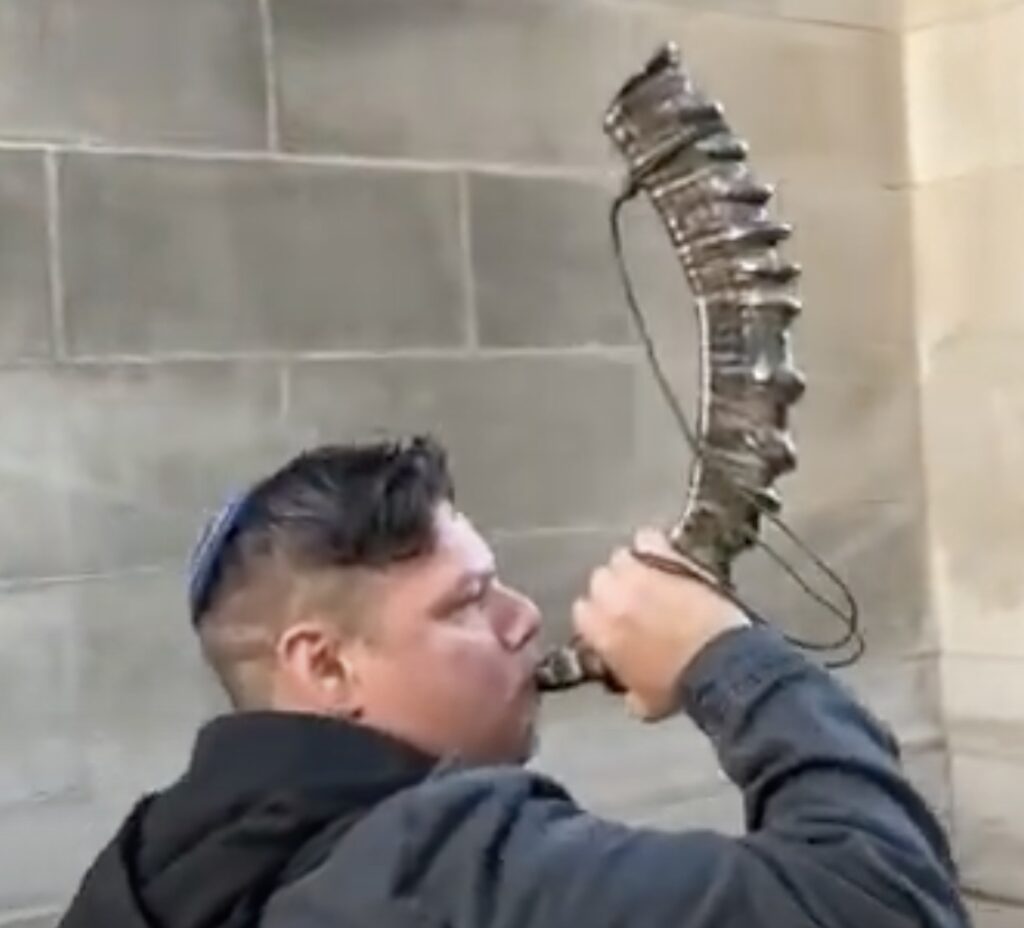 A man blowing a shofar