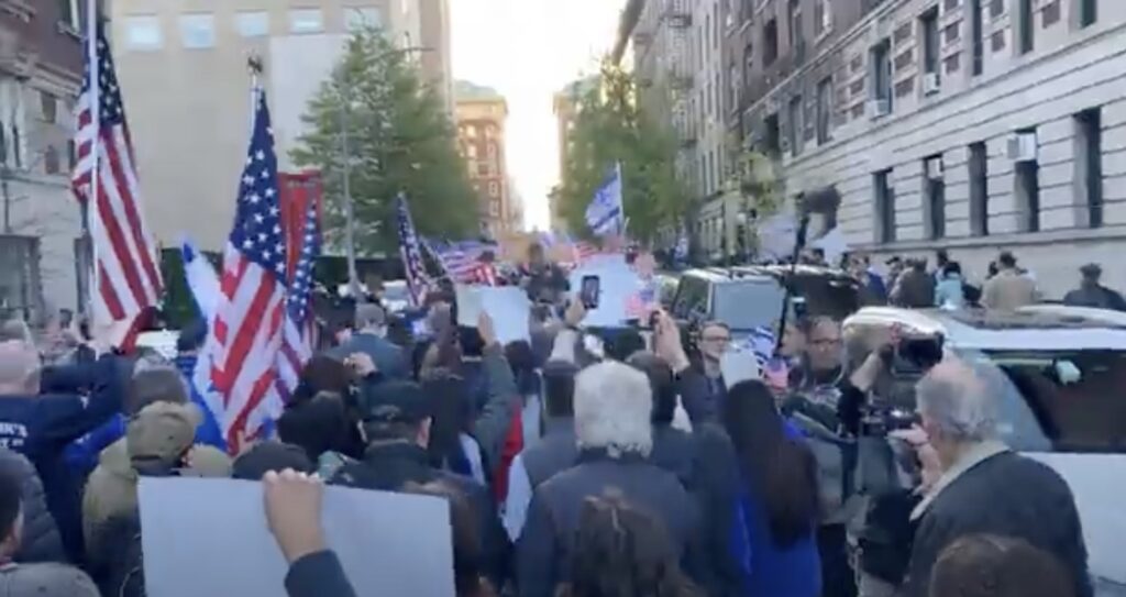 A crowd of pro-Israel protestors marches toward Columbia University